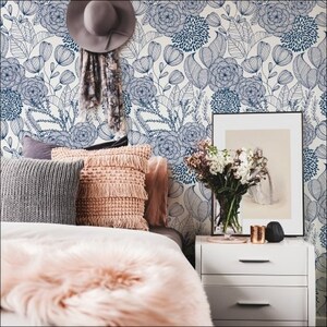 Bedroom with a blue wallpaper